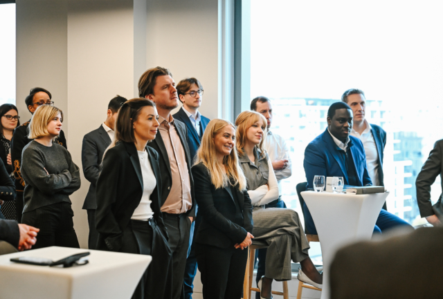 People listening to a speaker