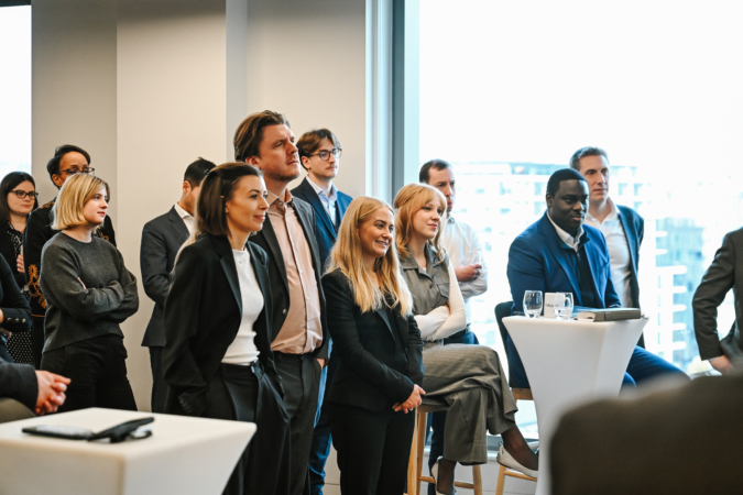 People listening to a speaker